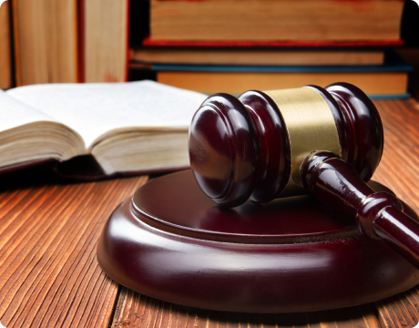 a judges gavel sitting on top of a wooden table